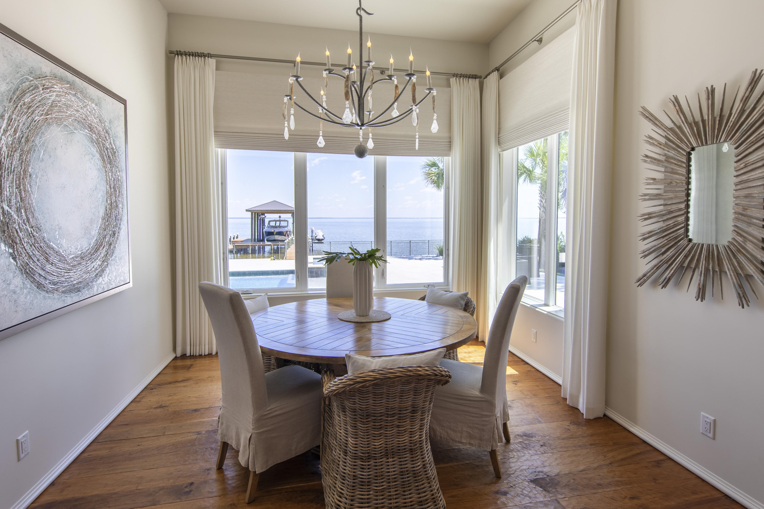1095 Driftwood Point Road Santa Rosa Beach, FL 32459 - Photo 15 of 44 a view of a dining room with furniture window and wooden floor