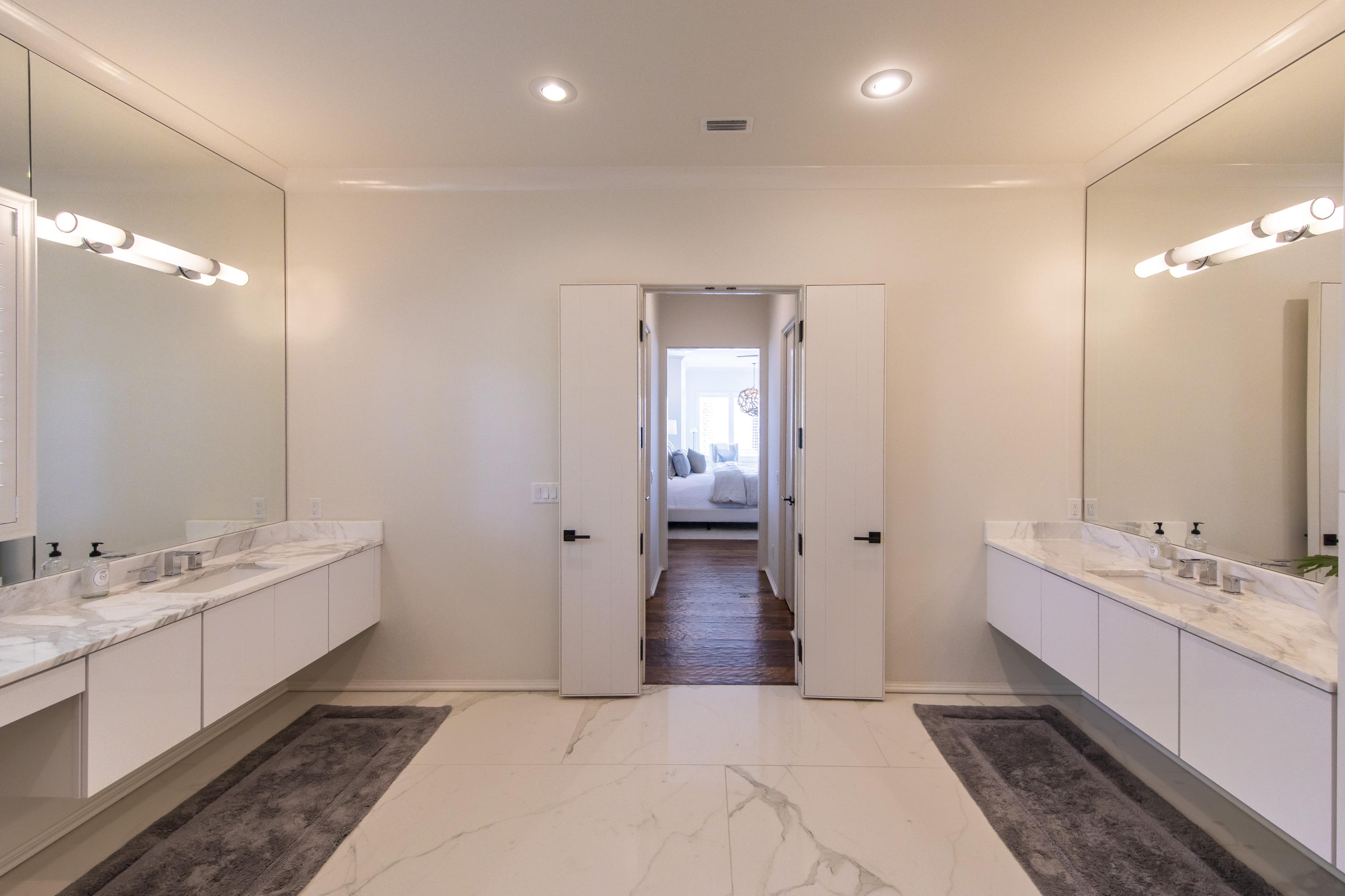 1095 Driftwood Point Road Santa Rosa Beach, FL 32459 - Photo 19 of 44 a bathroom with a double vanity sink and a mirror