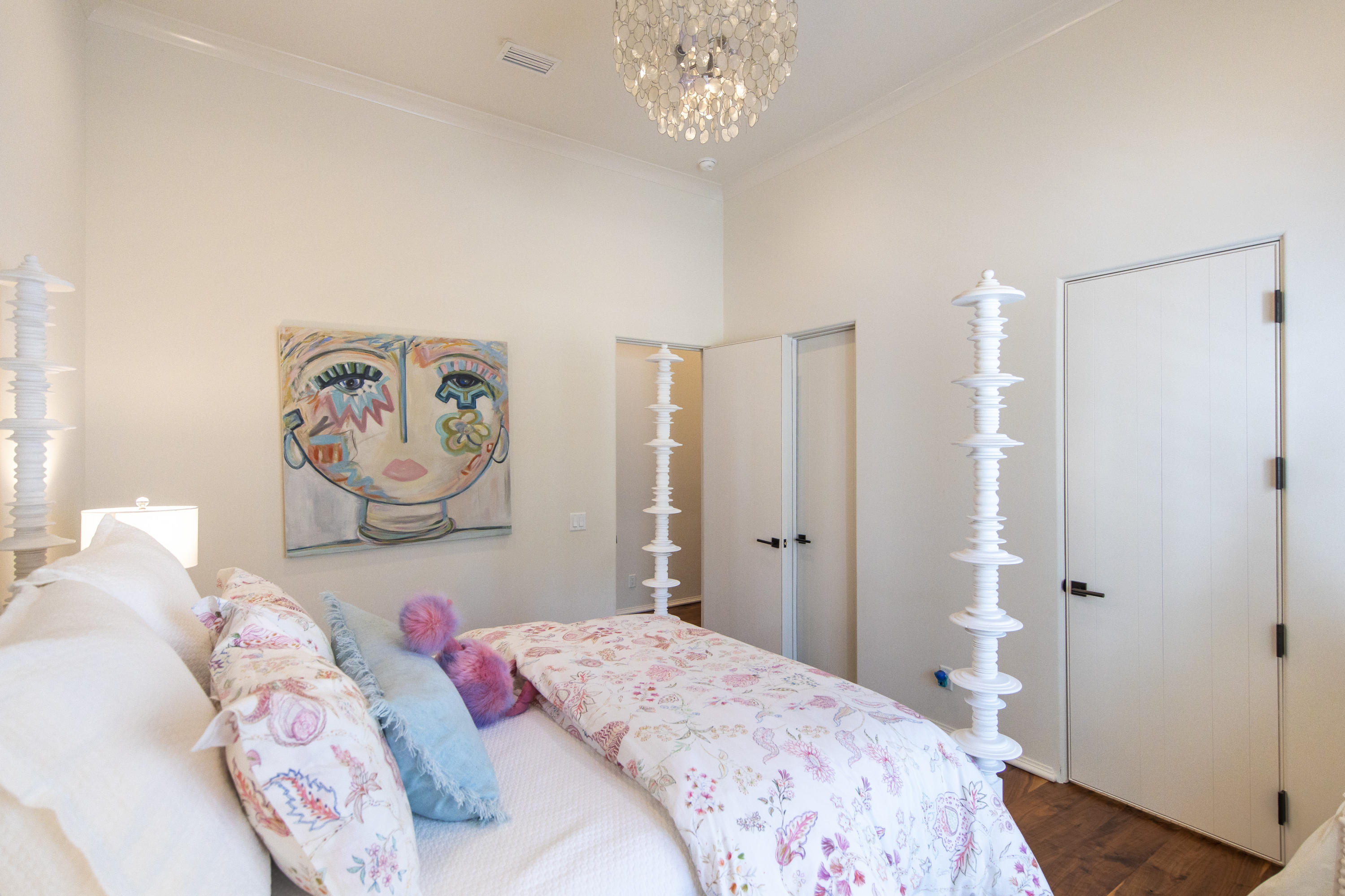 1095 Driftwood Point Road Santa Rosa Beach, FL 32459 - Photo 25 of 44 a bedroom with a bed and a chandelier