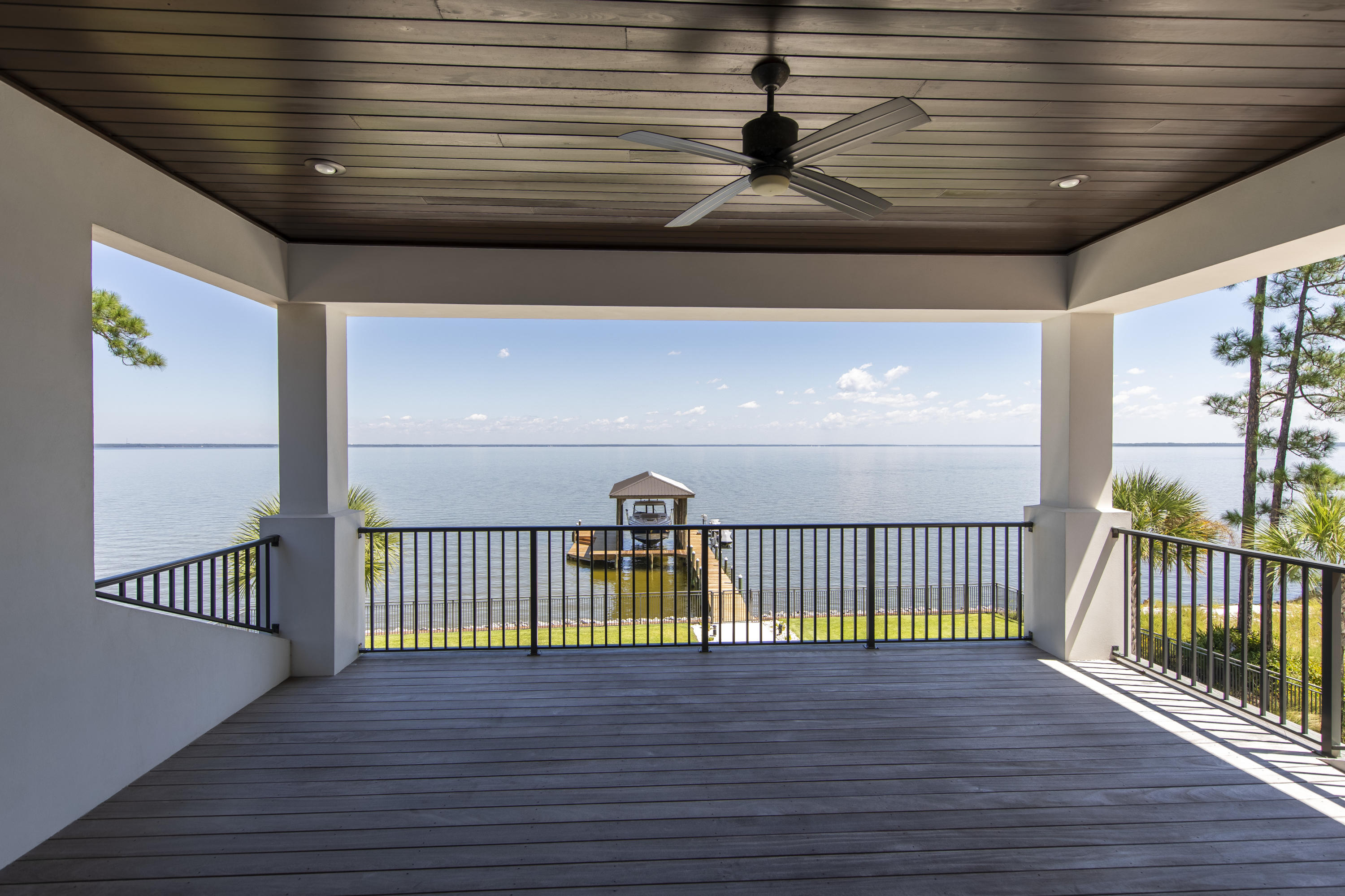 1095 Driftwood Point Road Santa Rosa Beach, FL 32459 - Photo 30 of 44 a view of a balcony with a ceiling fan