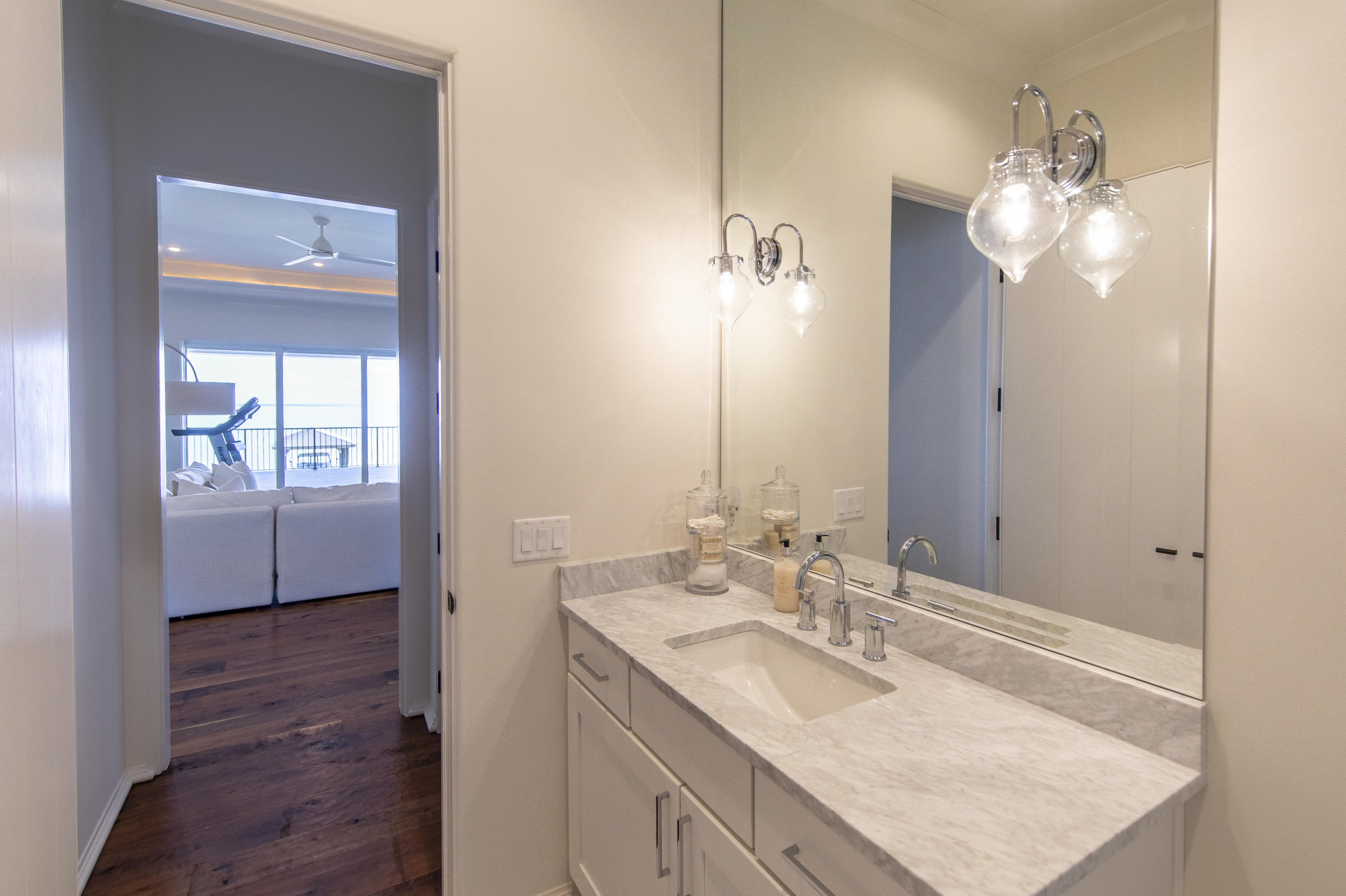 1095 Driftwood Point Road Santa Rosa Beach, FL 32459 - Photo 35 of 44 a bathroom with a granite countertop sink a light fixture and a mirror