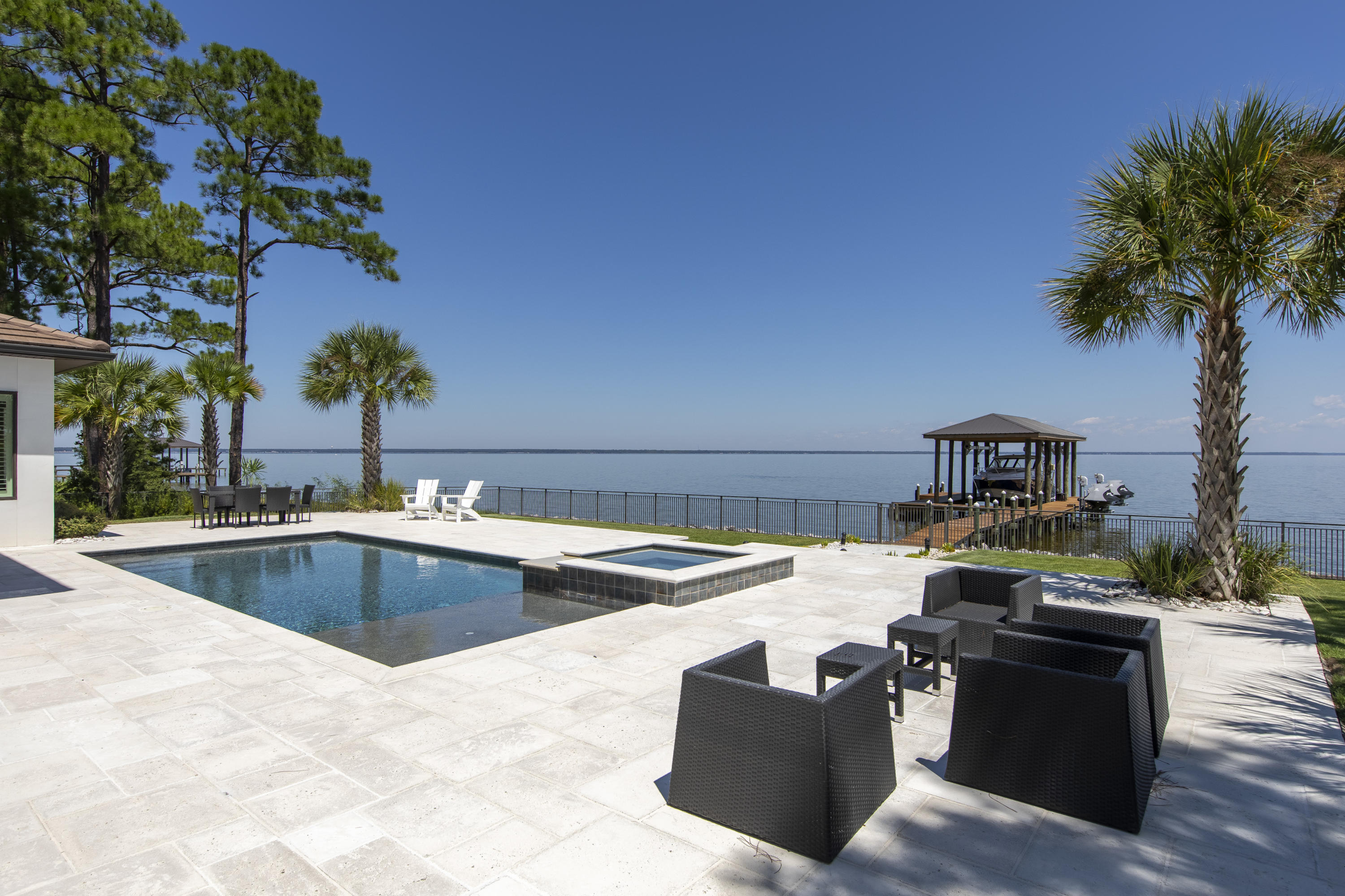 1095 Driftwood Point Road Santa Rosa Beach, FL 32459 - Photo 40 of 44 a view of a swimming pool with a patio