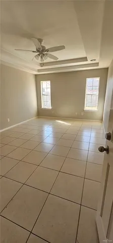 a bathroom with a granite countertop sink mirror vanity and toilet