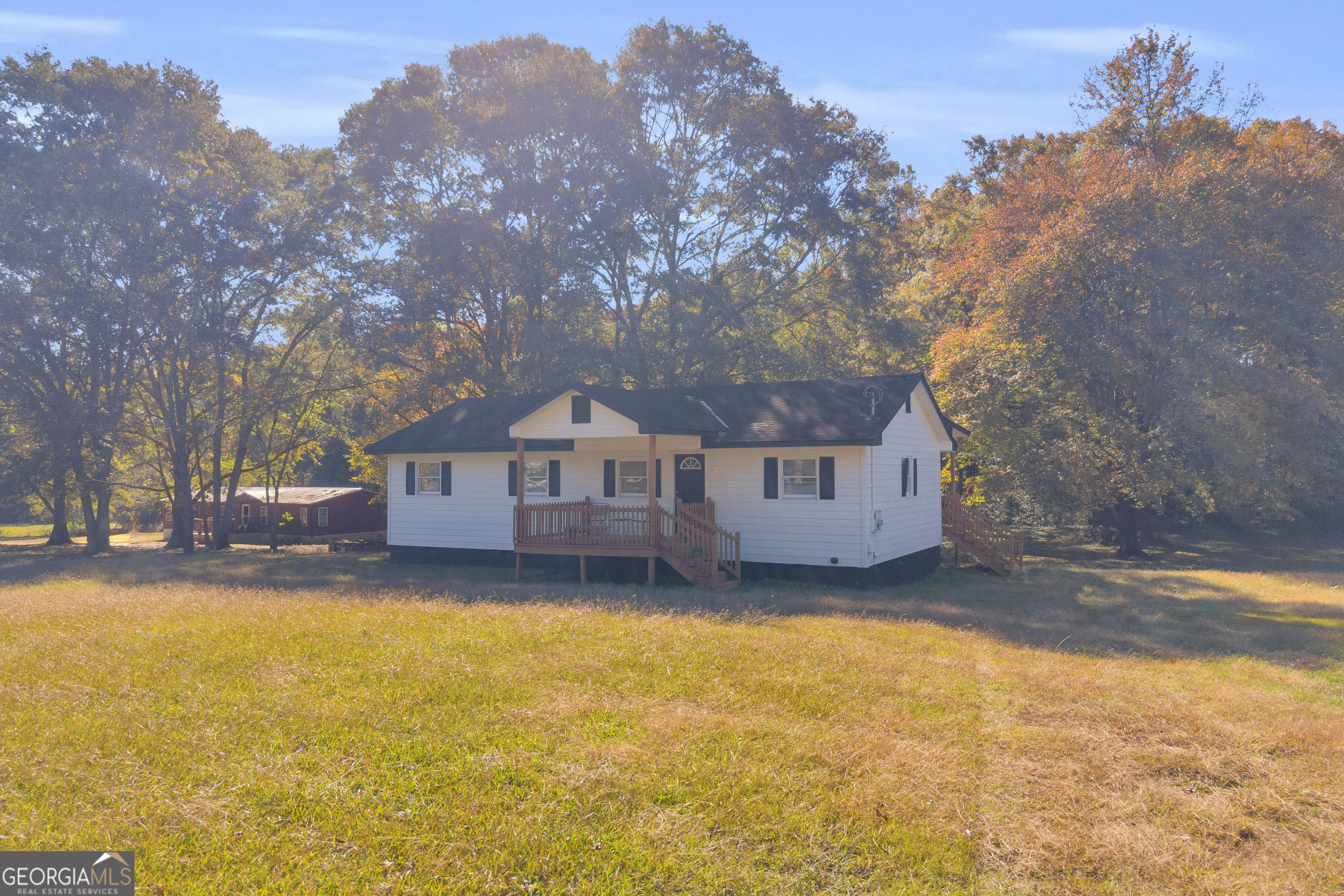 a house that has a tree in front of it