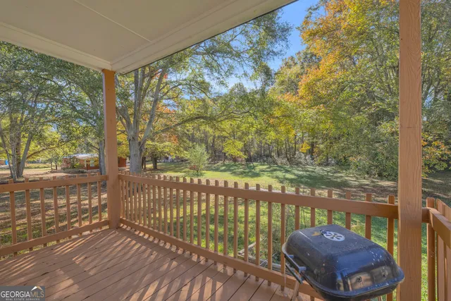 a view of a backyard of a house with a lake view