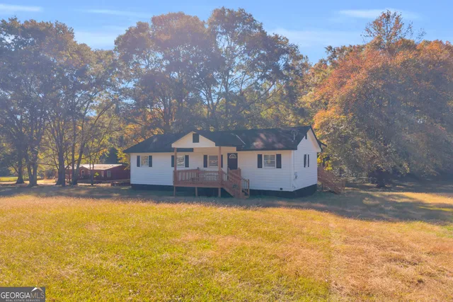 a house that has a tree in front of it