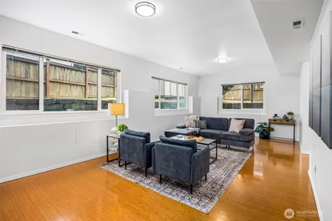 a living room with furniture rug and window