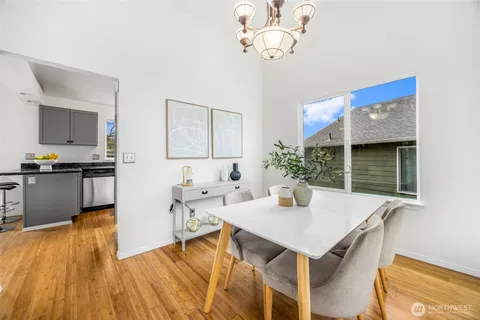 a view of kitchen and sink with wooden floor