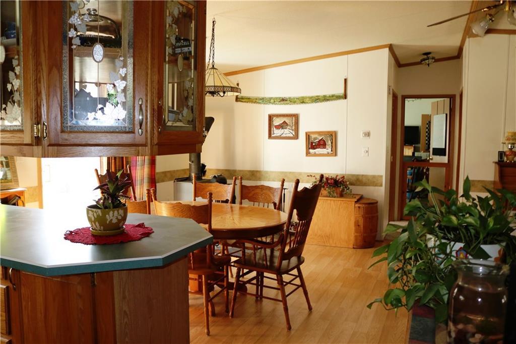 909 Mariaville Road Ellsworth, ME 04605 - Photo 3 of 30 Great dining area with wood stove...
