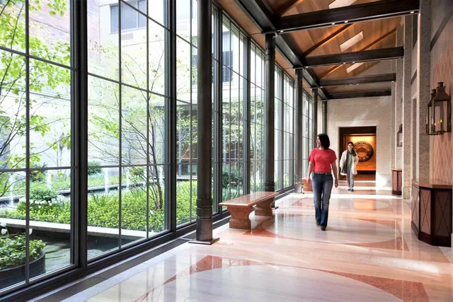 a living room filled with furniture and a large window
