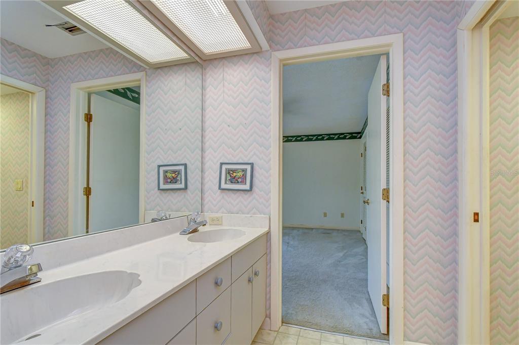 914 South Miller Road Valrico, FL 33594 - Photo 35 of 51 a bathroom with a granite countertop sink and a mirror