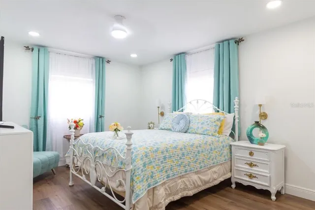 a bedroom with a bed and a baby crib