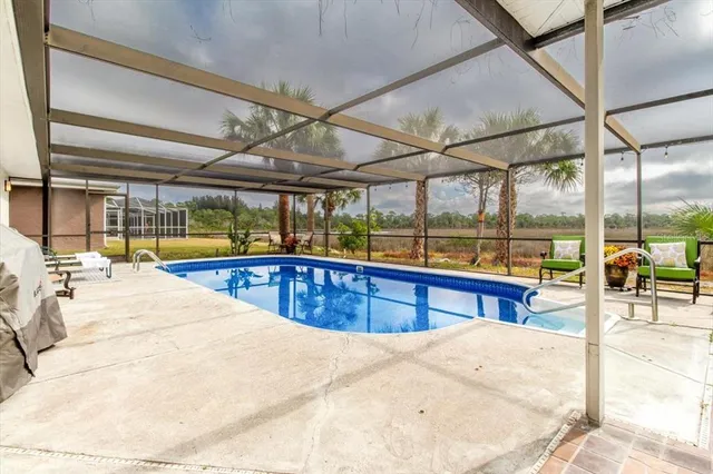 a living room with furniture and dining area