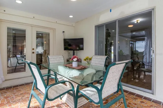 a view of a swimming pool with a porch