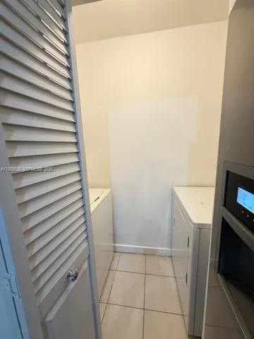 a bathroom with a sink and washing machine