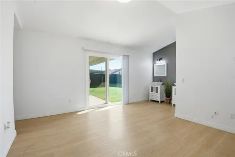 a view of an empty room with glass door