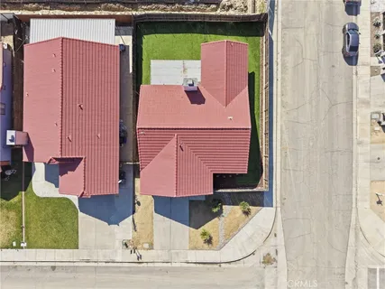 an aerial view of a house with swimming pool