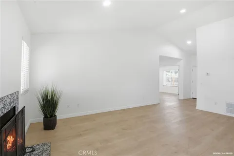 a view of an empty room and a window