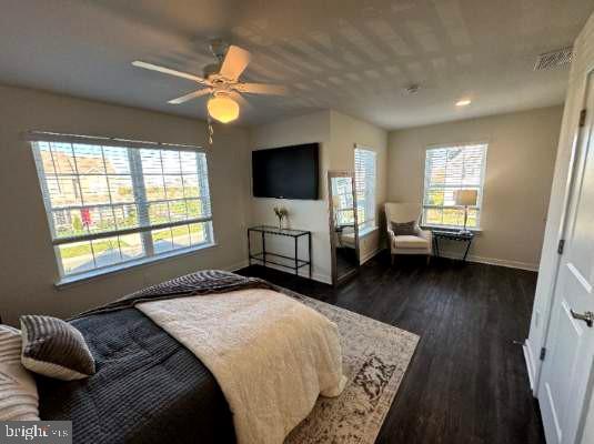 607 Ruth Way Dover, DE 19904 - Photo 8 of 10 a bedroom with a bed window and a flat screen television