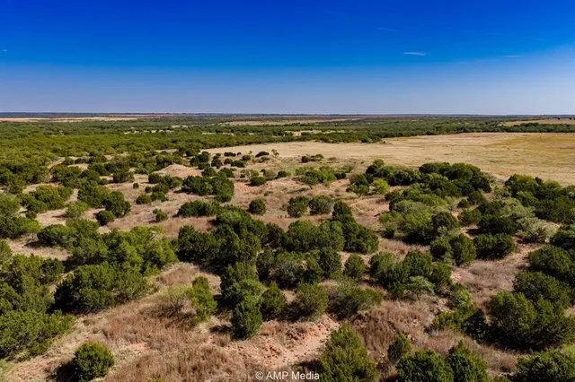 a view of a lake with houses in the back
