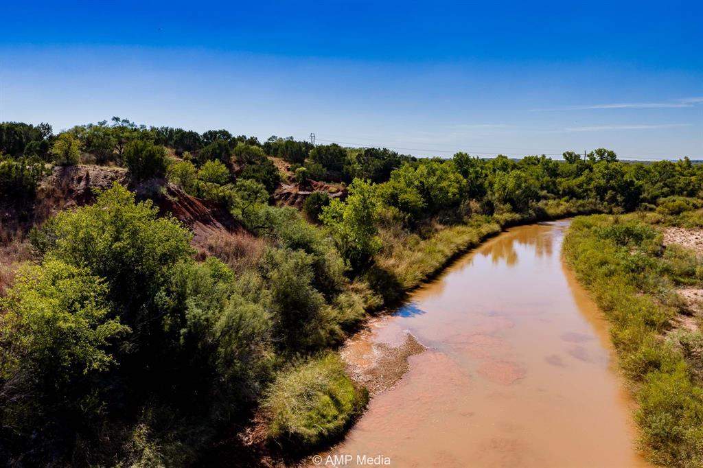0 County Road 454 Rule, TX 79548 - Photo 6 of 40 a view of a lake with a city