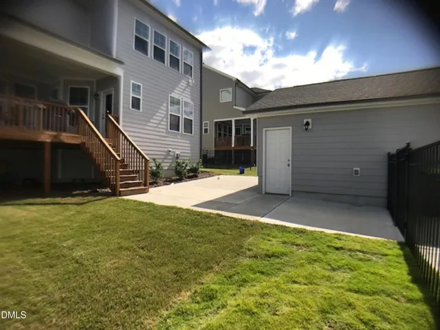 a view of a backyard of the house