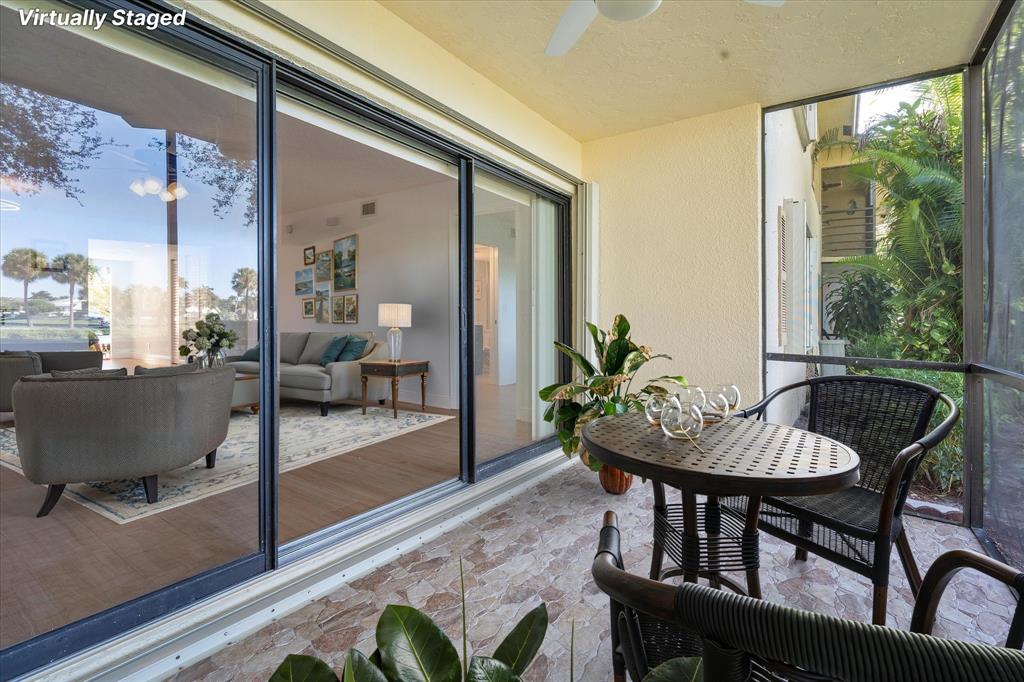 2900 Southwest 22nd Circle, Unit 221E Delray Beach, FL 33445 - Photo 25 of 43 a view of a dining room with furniture window and wooden floor