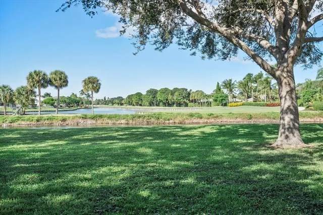 a view of a lake with houses in the back