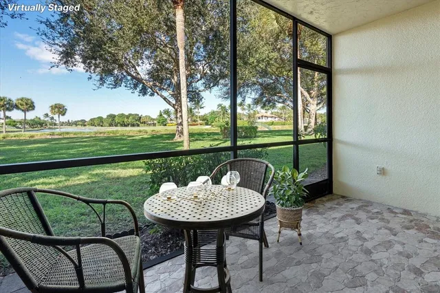 a backyard of a house with table and chairs