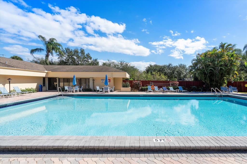 2900 Southwest 22nd Circle, Unit 221E Delray Beach, FL 33445 - Photo 32 of 43 a view of a house with a balcony