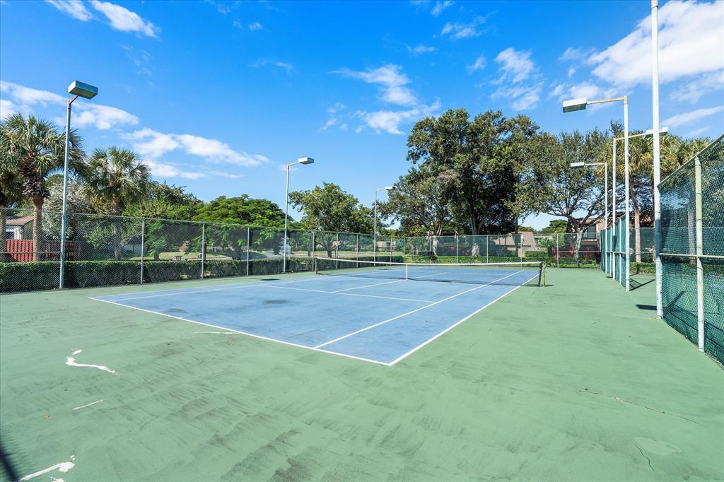2900 Southwest 22nd Circle, Unit 221E Delray Beach, FL 33445 - Photo 34 of 43 a view of a tennis court