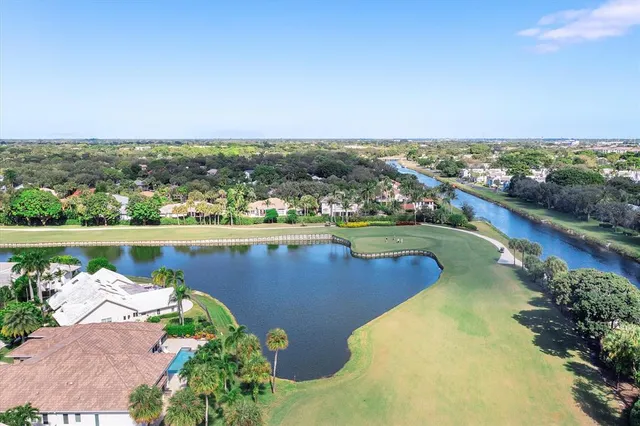 an aerial view of a city with lake view