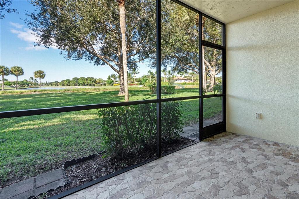 2900 Southwest 22nd Circle, Unit 221E Delray Beach, FL 33445 - Photo 4 of 43 a view of a garden from a balcony