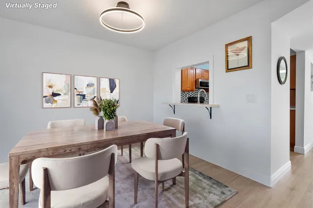 a dining room with furniture and window