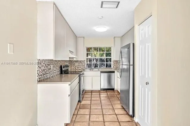 a view of a hallway with a window