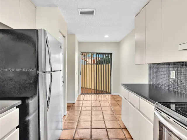 a view of a hallway with a window