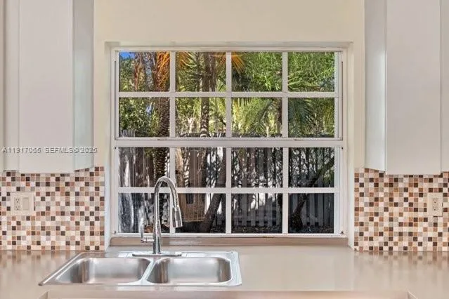 a view of a room with a large window