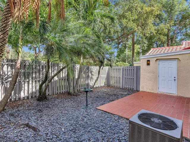 a backyard of a house with seating space