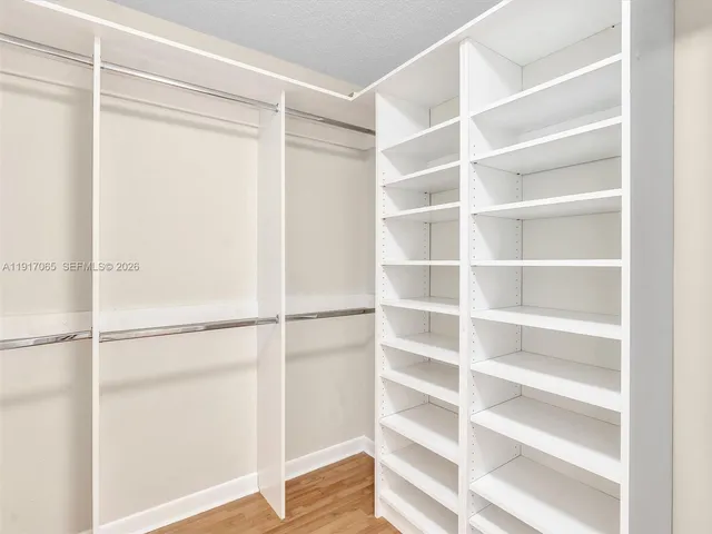 a view of a swimming pool with a lounge chairs