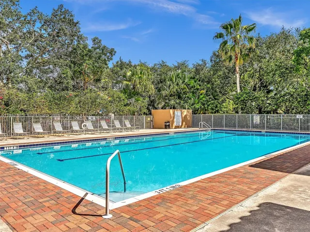 a dining room with furniture and a large window