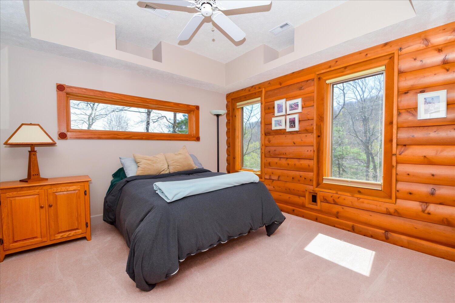 380 Hemlock Ridge Road Southeast Copper Hill, VA 24079 - Photo 12 of 59 a bedroom with a bed and next to a window