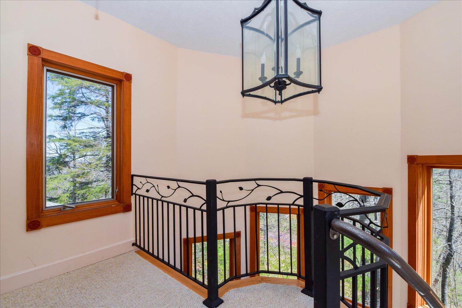 380 Hemlock Ridge Road Southeast Copper Hill, VA 24079 - Photo 14 of 59 a view of a hallway with wooden floor and staircase