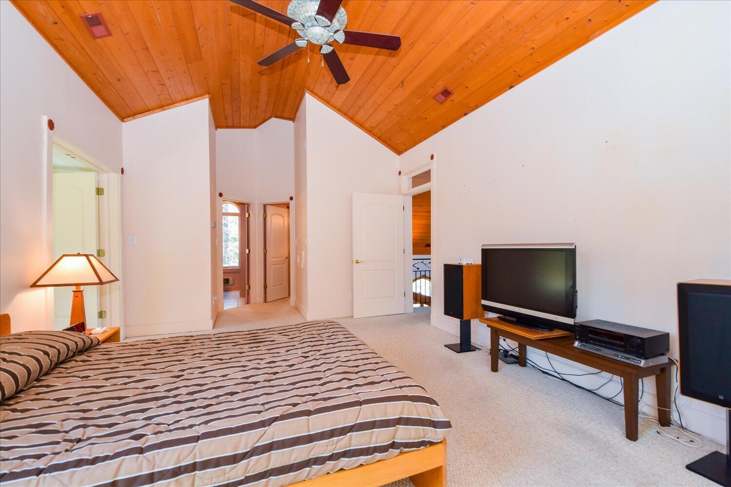 380 Hemlock Ridge Road Southeast Copper Hill, VA 24079 - Photo 15 of 59 a bedroom with a bed and a flat screen tv