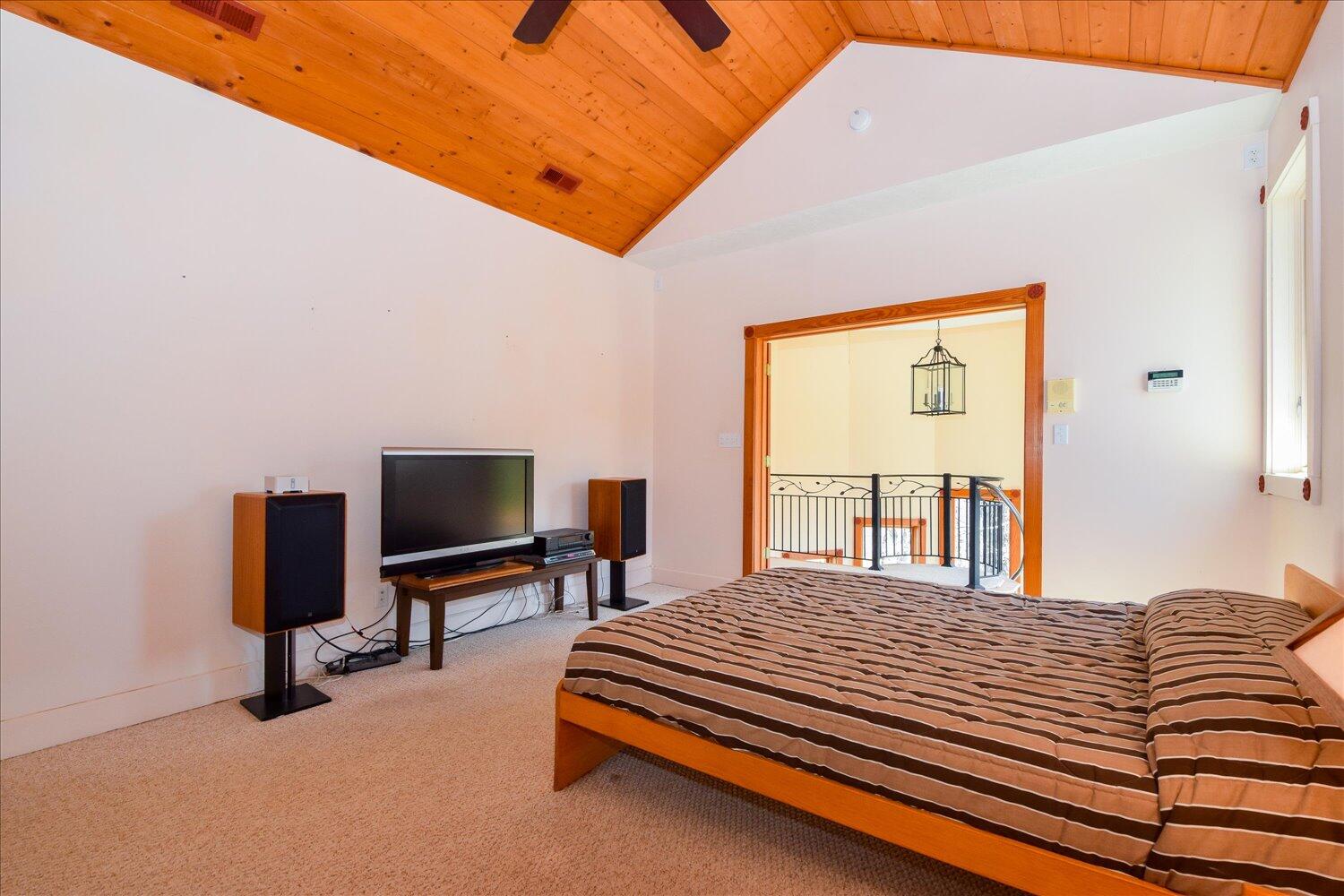 380 Hemlock Ridge Road Southeast Copper Hill, VA 24079 - Photo 16 of 59 a bedroom with a bed and a flat screen tv