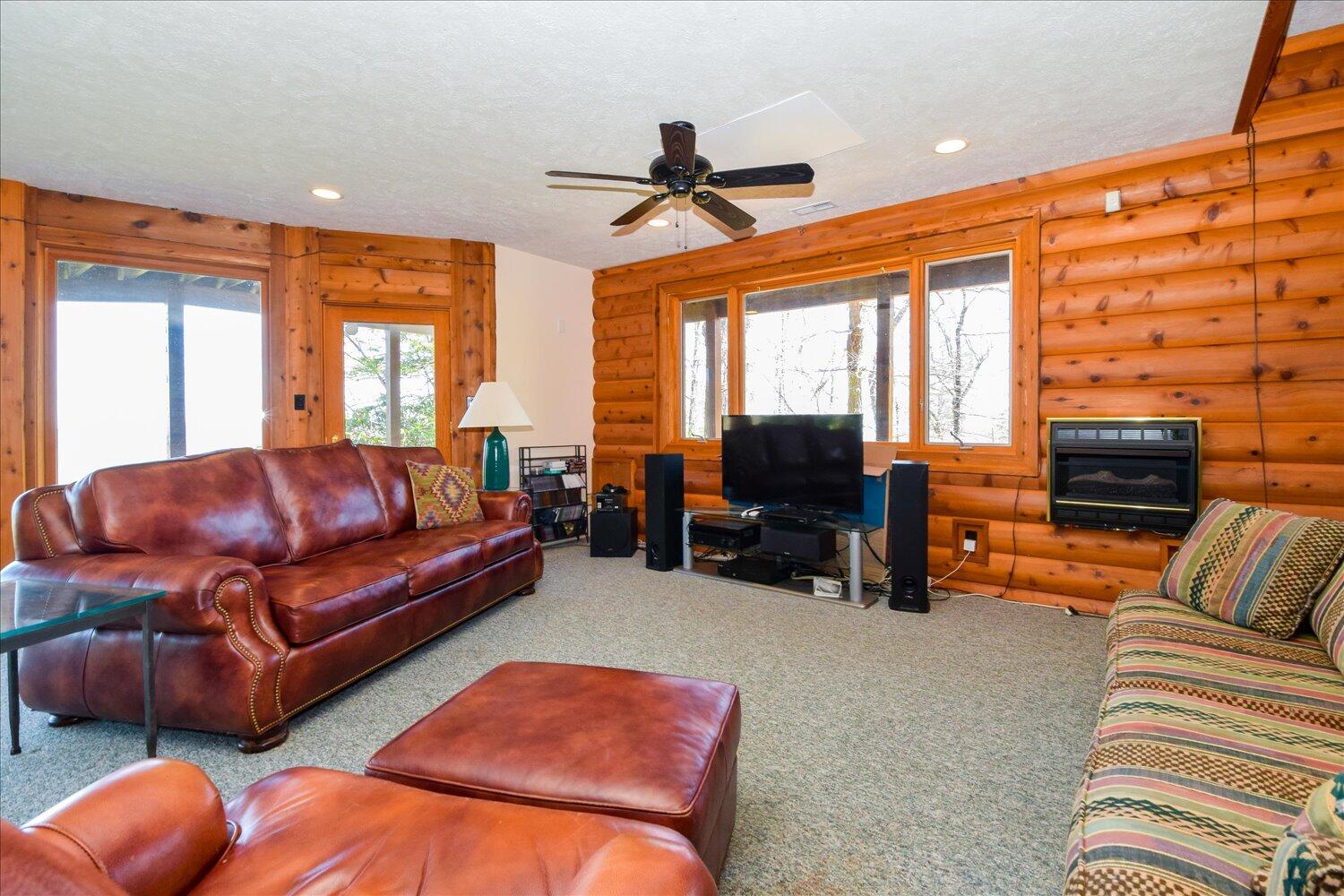 380 Hemlock Ridge Road Southeast Copper Hill, VA 24079 - Photo 25 of 59 a living room with furniture a ceiling fan and a window