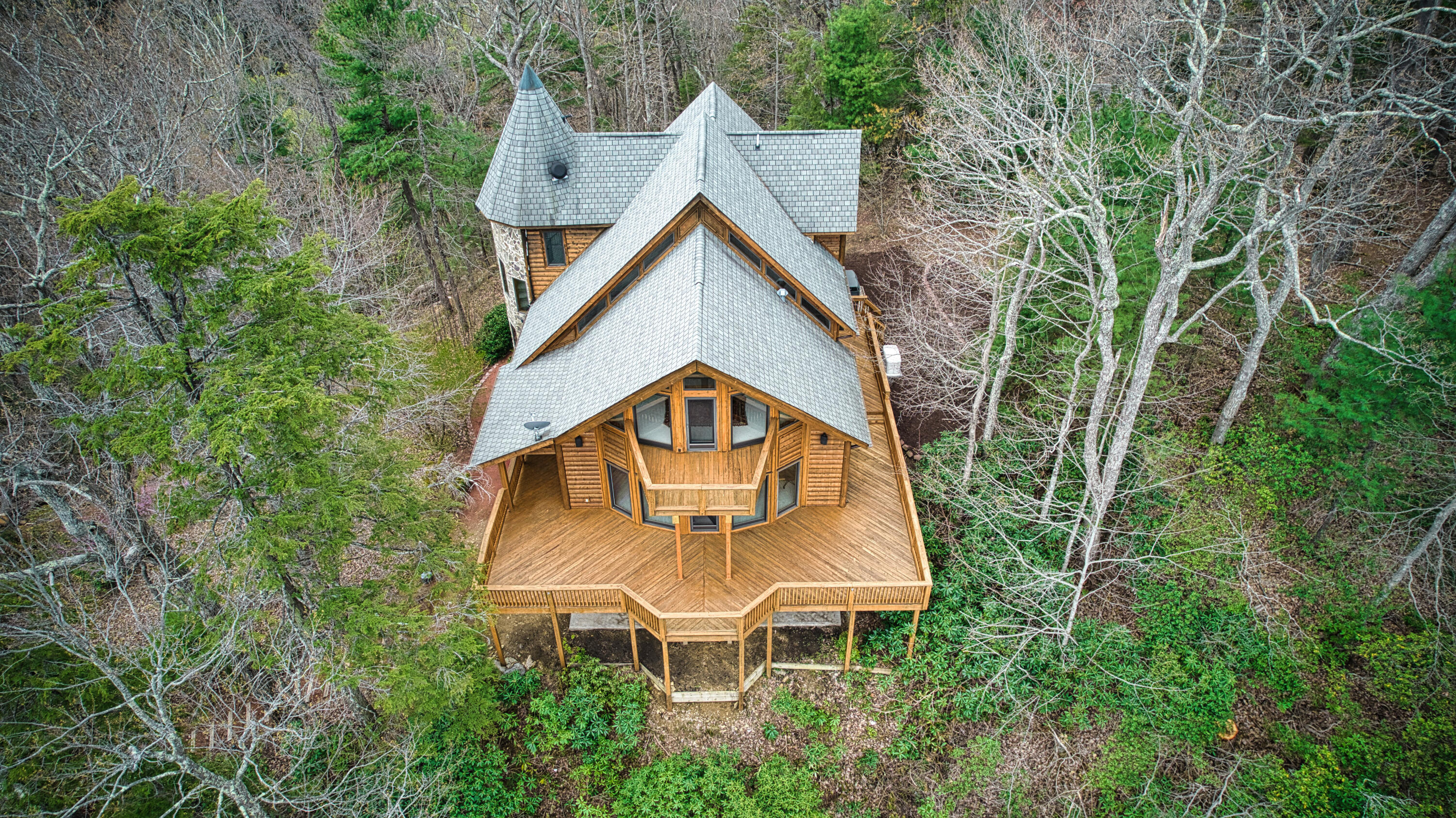 380 Hemlock Ridge Road Southeast Copper Hill, VA 24079 - Photo 40 of 59 an aerial view of a house with table and chairs under an umbrella