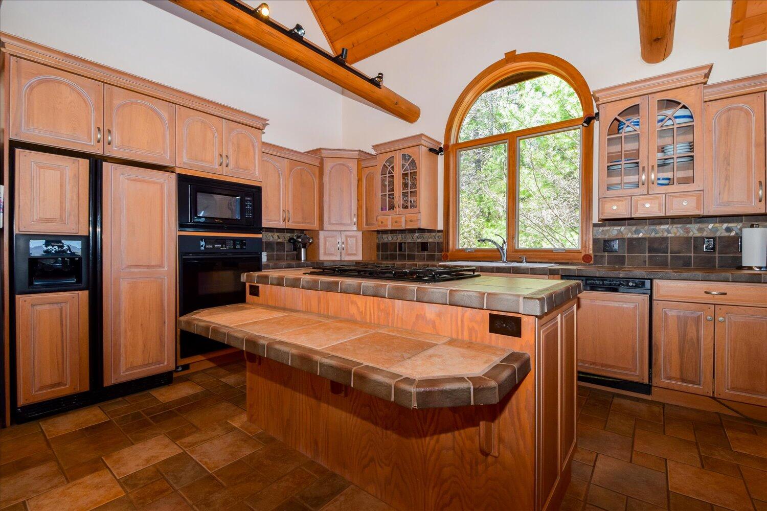 380 Hemlock Ridge Road Southeast Copper Hill, VA 24079 - Photo 5 of 59 a kitchen with stainless steel appliances granite countertop a stove a sink dishwasher and a refrigerator with wooden floor