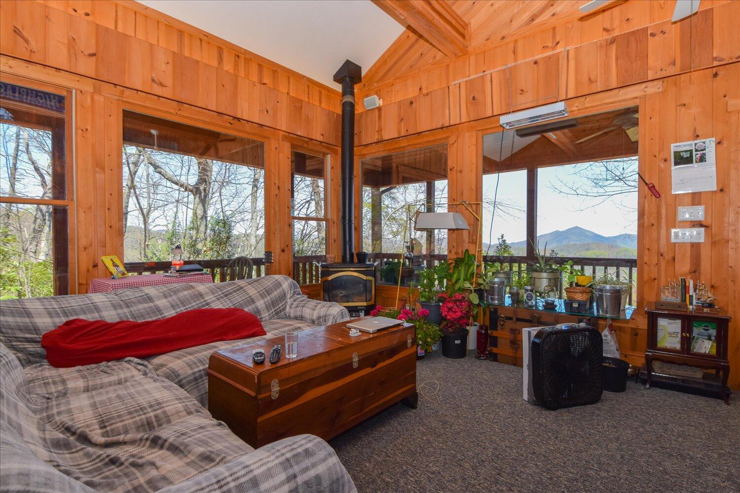 380 Hemlock Ridge Road Southeast Copper Hill, VA 24079 - Photo 53 of 59 a living room filled with furniture and a floor to ceiling window