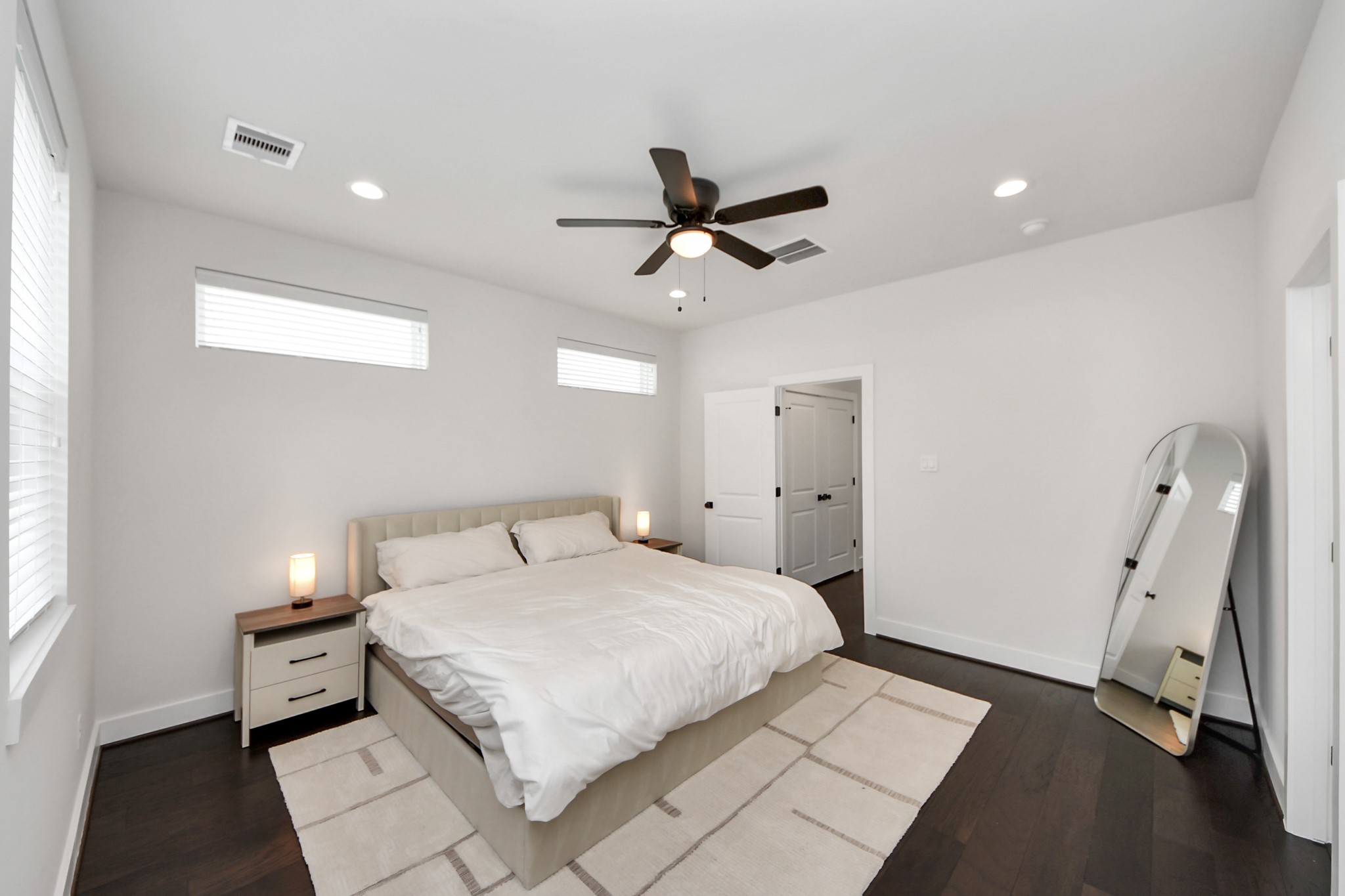 5502 Wheatley Street, Unit B Houston, TX 77091 - Photo 24 of 35 a bedroom with a bed and a ceiling fan