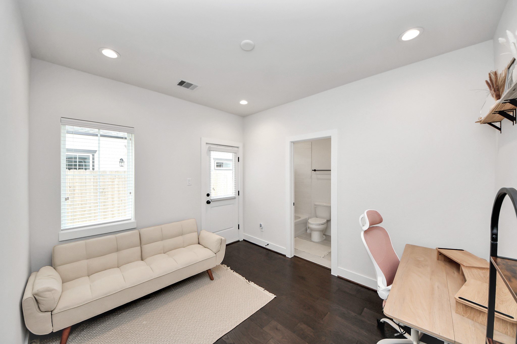 5502 Wheatley Street, Unit B Houston, TX 77091 - Photo 3 of 35 a living room with furniture and a window